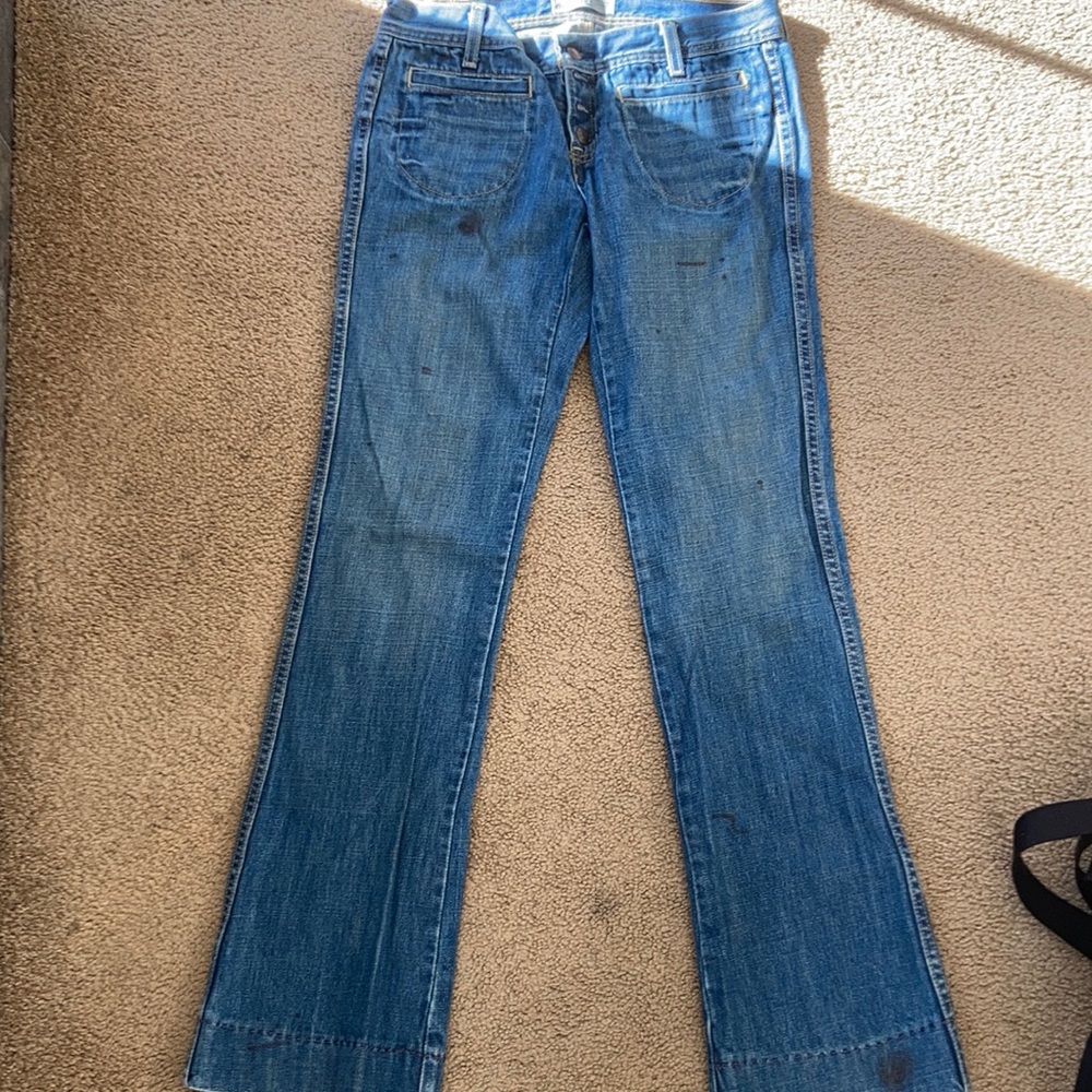 Jeans that were made purposely with stains and “wear” markings.